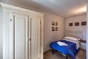 Albergo Diffuso Sutrio Zoncolan客房内的一张或多张床位