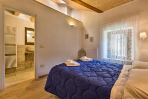 Albergo Diffuso Sutrio Zoncolan客房内的一张或多张床位