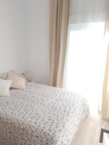 Кровать или кровати в номере Apartamentos Villajovita