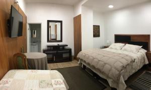 Cama ou camas em um quarto em Eco Hostal Offenbacher-Hof