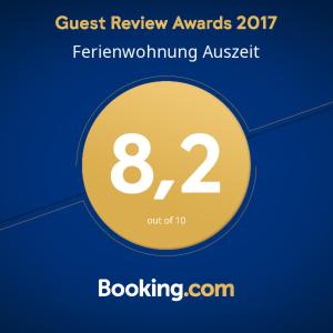 a sign that reads guest review awards feathergivinggiving austatch at Ferienwohnung Auszeit in Fischen