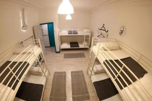 Cama ou camas em um quarto em My Hostel