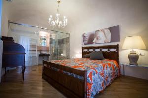 a bedroom with a bed with a laptop on it at Bed&Breakfast JSuite in Gioia del Colle