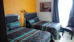 Postel nebo postele na pokoji v ubytování Suites Sta Tere