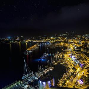 a view of a harbor at night with boats at Mare e vista appartement 3 chambres in Calvi