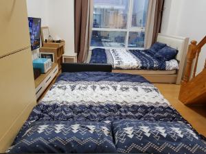 서울 스테이션 듀플렉스 아파트먼트 객실 침대