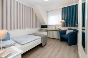 TV a/nebo společenská místnost v ubytování Hotel Berlin
