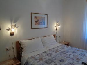 Postel nebo postele na pokoji v ubytování Casa Noemi Imer