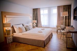 מיטה או מיטות בחדר ב-Jungmann Hotel