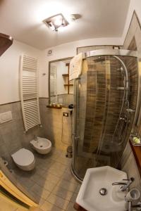 a bathroom with a shower and a toilet and a sink at 19Venti in Lecce