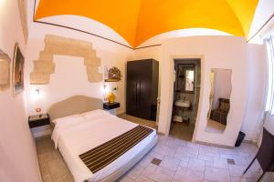 a bedroom with a large bed in a room at 19Venti in Lecce