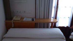 Postel nebo postele na pokoji v ubytování La Plaza I