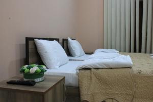 Una cama o camas en una habitación de Ideal