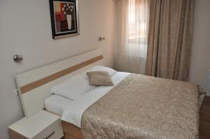 Postel nebo postele na pokoji v ubytování Hotel Prima