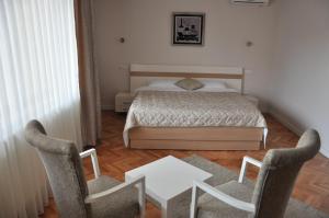 Postel nebo postele na pokoji v ubytování Hotel Prima