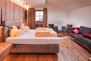 Rúm í herbergi á Bauernhof Hotel Oberschwarzach