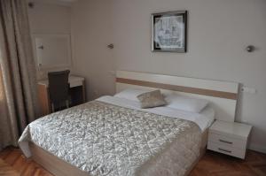 Postel nebo postele na pokoji v ubytování Hotel Prima