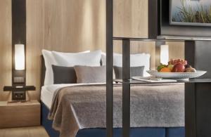 Rúm í herbergi á Hotel Weisses Roessl