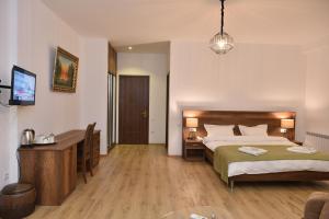 Voodi või voodid majutusasutuse Hotel King Tom toas
