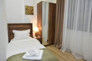 Voodi või voodid majutusasutuse Hotel King Tom toas