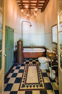 a bathroom with a tub and a toilet and a sink at El Asiento Del Azar in Banyeres del Penedes +53 photos