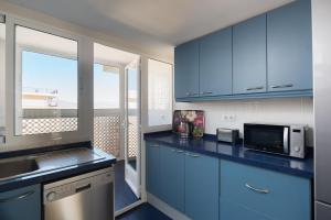 Kuchyňa alebo kuchynka v ubytovaní Apartamentos Marta PLAYA