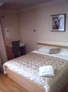 Postel nebo postele na pokoji v ubytování Hotel Prima
