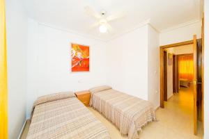A bed or beds in a room at ALEGRIA ID51
