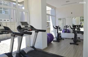 a gym with several treadmills and exercise bikes at Mareas del Golfo in Las Grutas