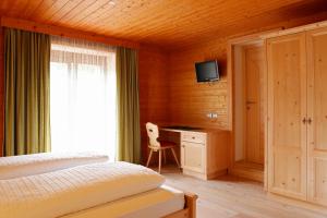 Postel nebo postele na pokoji v ubytování Garnì Iosc