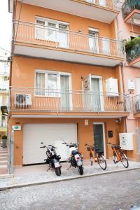 a group of motorcycles parked in front of a building at Residence Torino in Chioggia