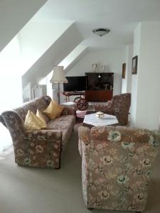 a living room with a couch and a table at Haus Schönblick in Bad Bertrich