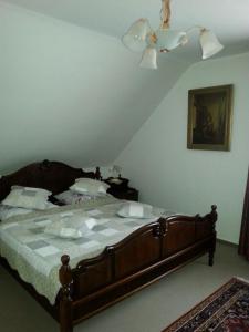 a bedroom with a large bed with a ceiling at Haus Schönblick in Bad Bertrich