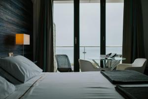 Postel nebo postele na pokoji v ubytování Hotel Arbe