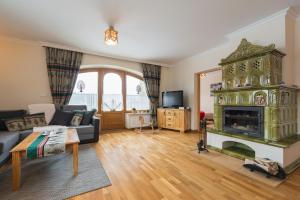 Televízia a/alebo spoločenská miestnosť v ubytovaní Apartment Tatrachata