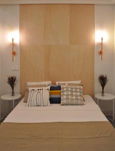 a bedroom with a large bed with two tables at Apartment Muñoz 2 in Alicante