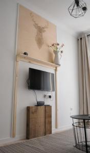 a flat screen tv on a wall in a living room at Apartment Muñoz 2 in Alicante