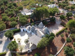 an overhead view of an old house in a park at Relais Trullo degli Emme in Ostuni