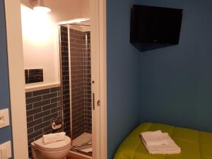 
a bathroom with a toilet and a sink at La Terrazza di Carolina in Agrigento
