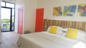 Postel nebo postele na pokoji v ubytování Pura Vista Hotel