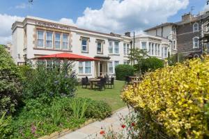 a view of the malcolm hotel from the garden at Lauriston Hotel in Weston-super-Mare