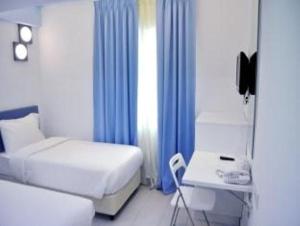 Postel nebo postele na pokoji v ubytování YY318 Hotel Bukit Bintang