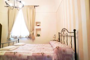 Posteľ alebo postele v izbe v ubytovaní Al Vecchio Cellaio Historical Guest House