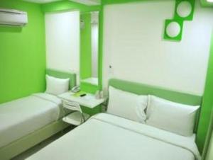 Postel nebo postele na pokoji v ubytování YY318 Hotel Bukit Bintang