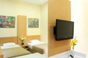 Telewizja i/lub zestaw kina domowego w obiekcie Daily Home
