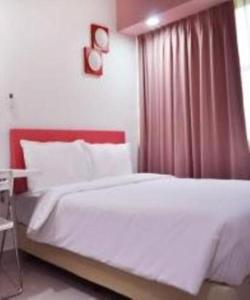 Postel nebo postele na pokoji v ubytování YY318 Hotel Bukit Bintang
