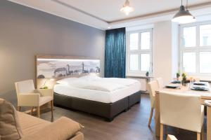 Ένα ή περισσότερα κρεβάτια σε δωμάτιο στο Aparthotel by dasPaul