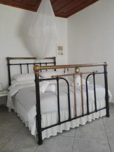 Postel nebo postele na pokoji v ubytování Trouli House