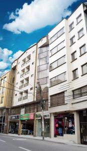 a white building on the side of a street at Hotel Santa Isabel 2 in Ipiales