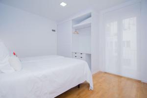 Postel nebo postele na pokoji v ubytování Apartamento Recogidas 39